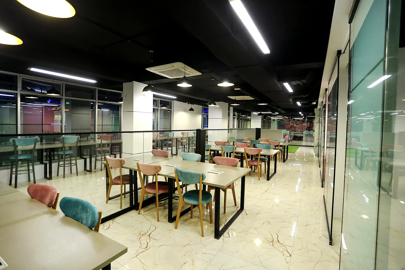 Open coworking floor with shared desks at TheWing.pk Islamabad